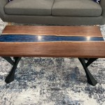 24" x 48" solid walnut and blue epoxy coffee table with black iron legs