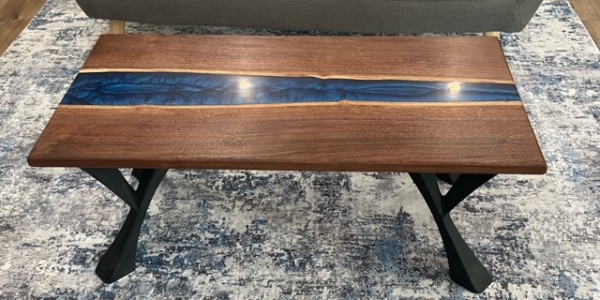 24" x 48" solid walnut and blue epoxy coffee table with black iron legs